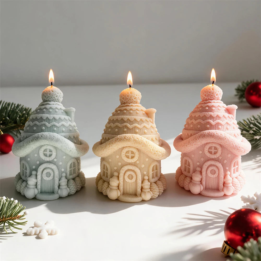 Pastel cottage candles with tiered snow-like roofs and arched doors