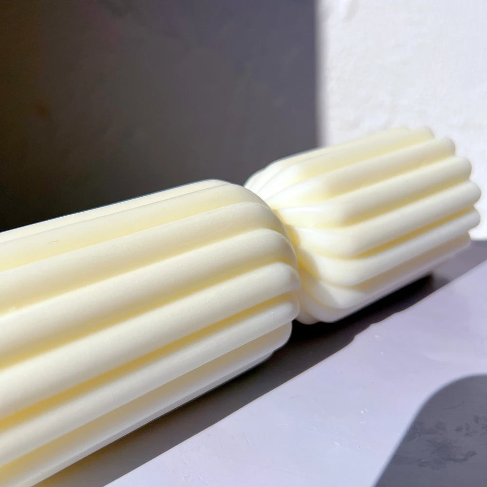 Close view of the narrow junction between ribbed candle sections