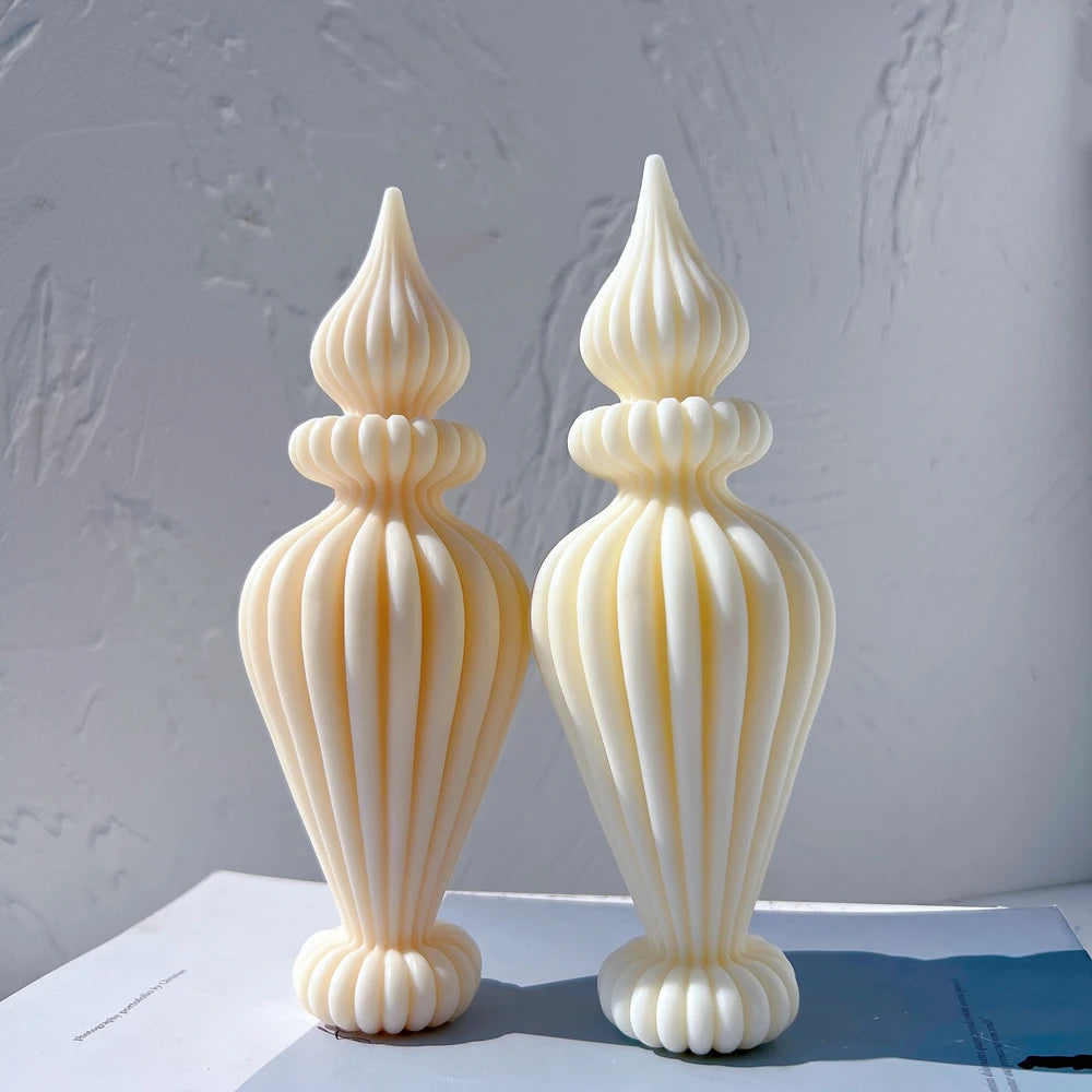 Pair of pointed ribbed pillar candle castings