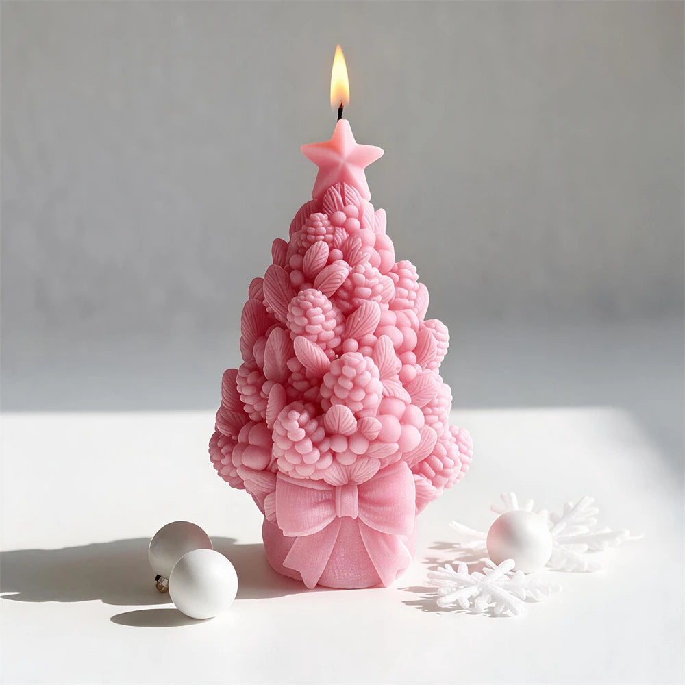 Pink star-topped tree casting with pinecones and rounded relief clusters