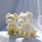 Schnauzer puppy figures showing their bearded muzzles from an angle
