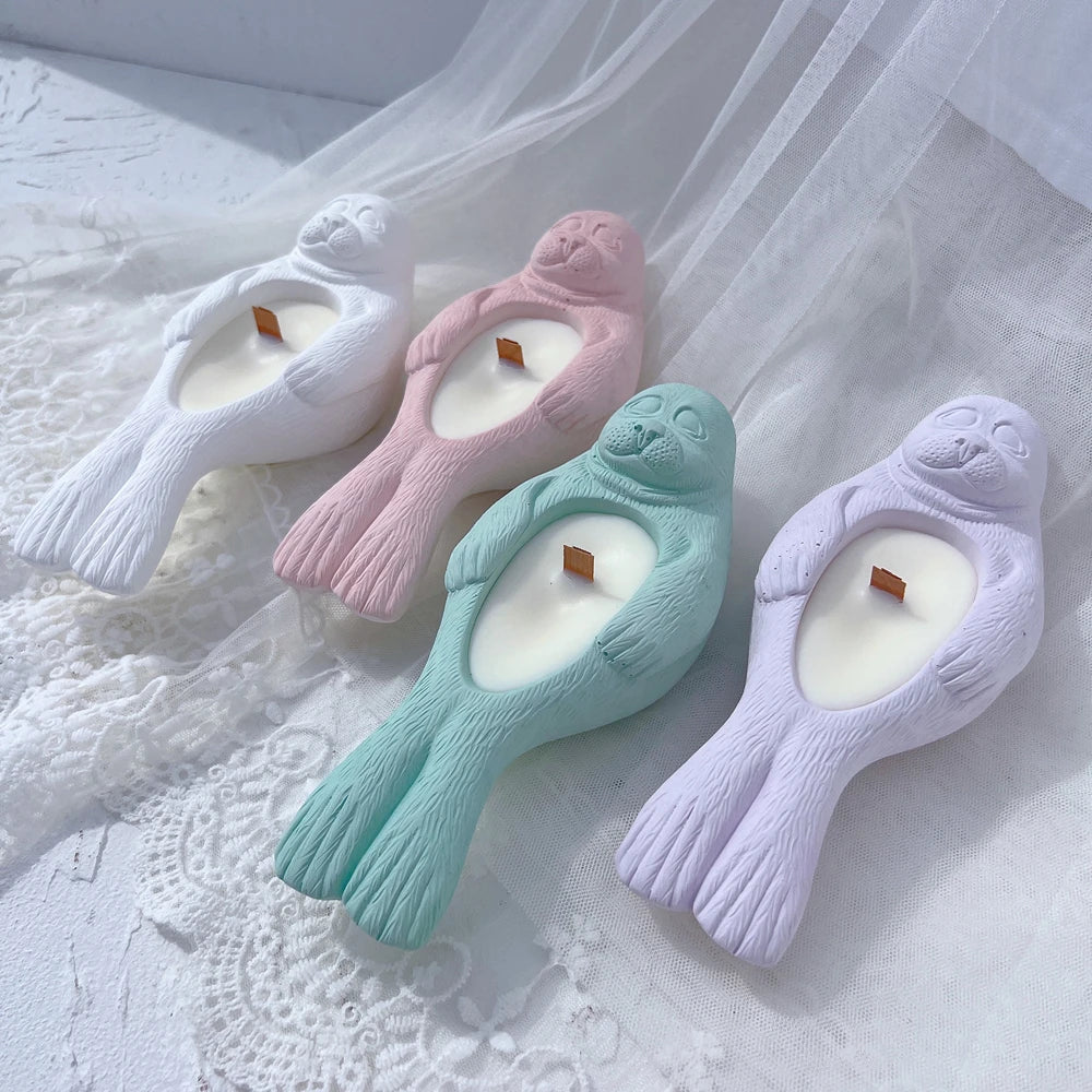 Seal-shaped holders with oval belly recesses and extended tails