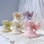 Angled display of angel candles with broad outstretched wings