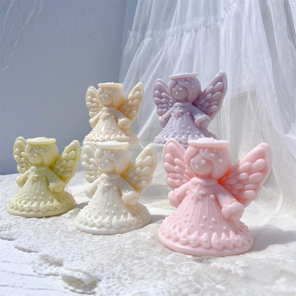 Angled display of angel candles with broad outstretched wings