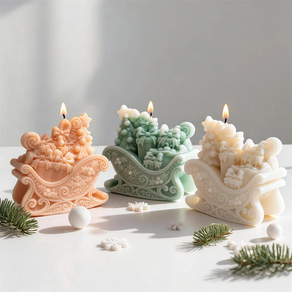 Three gift-filled sleigh candle castings with curled runners