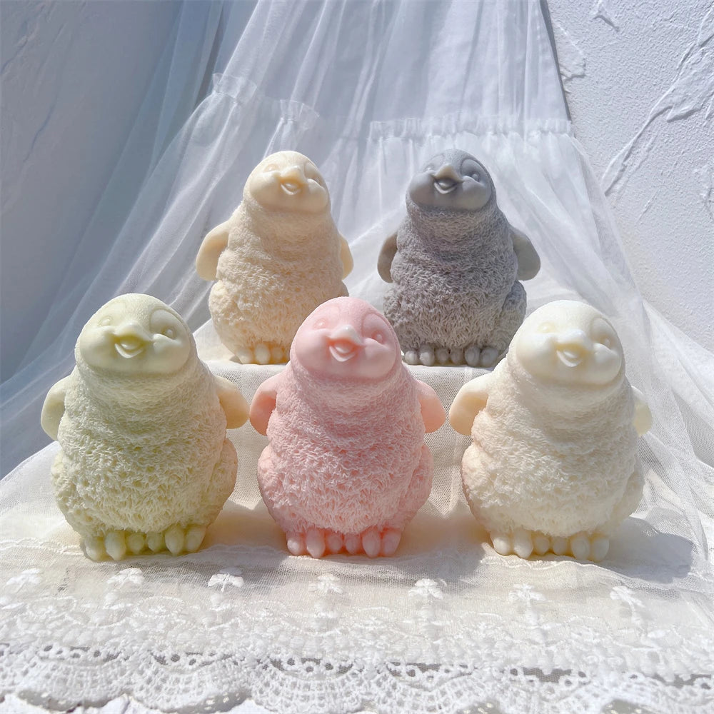 Five penguin figures showing small flippers and feet