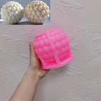 Pink silicone ball mold with a layered teardrop-scale cavity