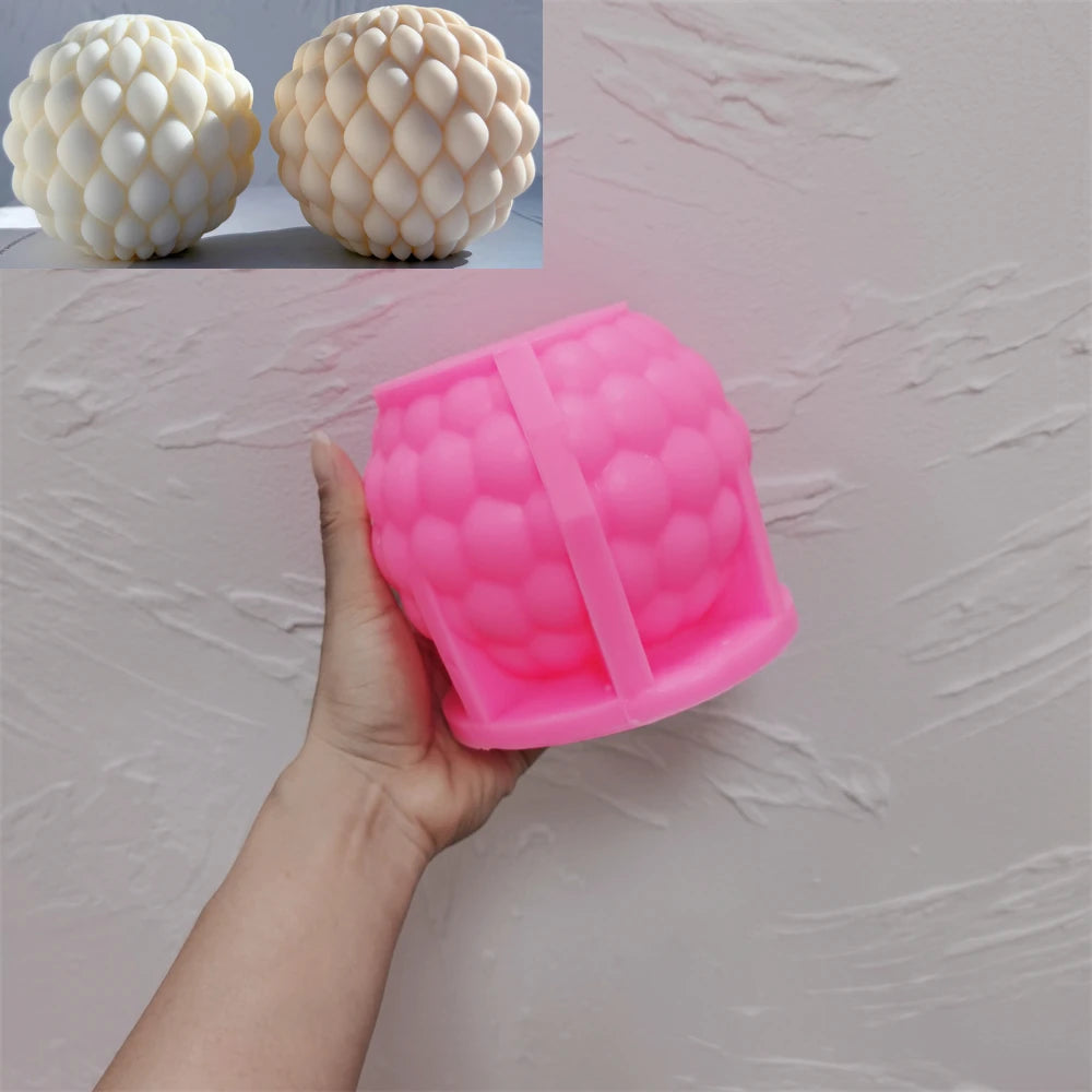 Pink silicone ball mold with a layered teardrop-scale cavity