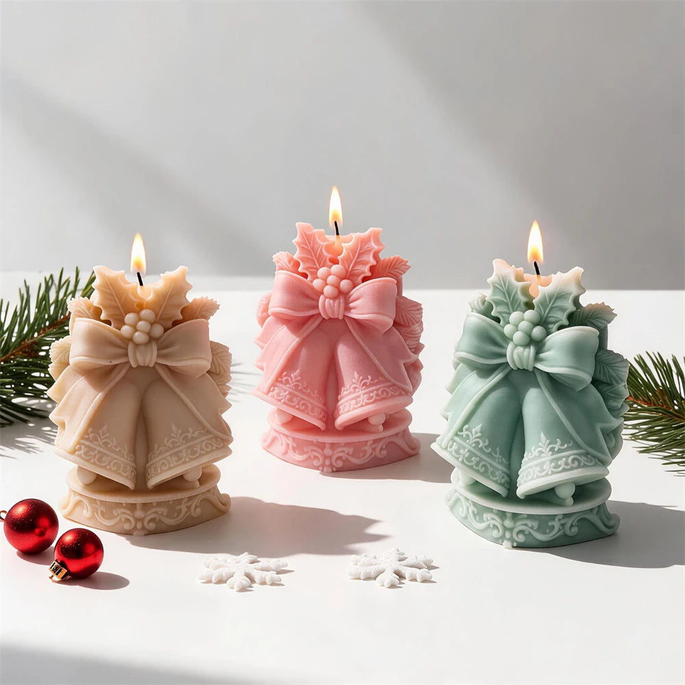 Cream pink and green Christmas bell candles with ribbon bows