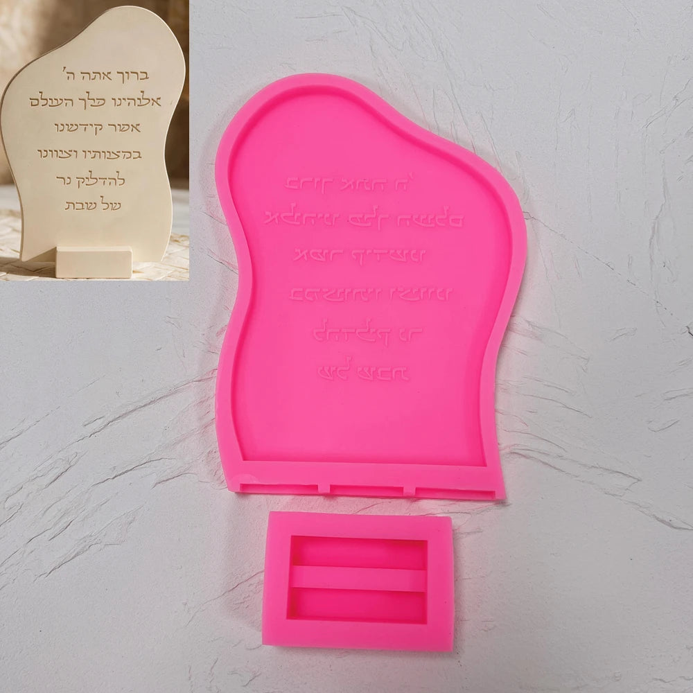 Pink silicone mold pieces for curved Hebrew-inscription plaque and separate stand