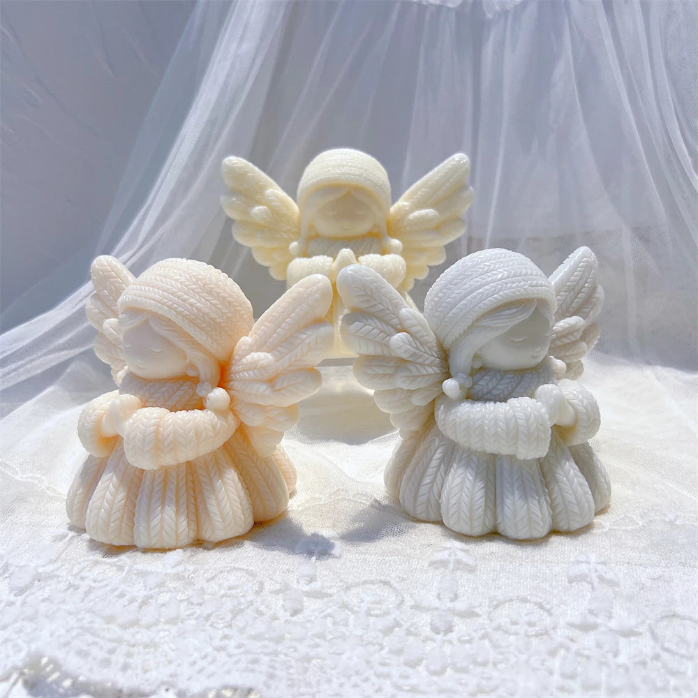 Cream and gray praying angels showing robe and wing textures
