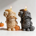 Standing pumpkin gnome candles carrying skull-topped staffs