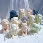 Decorative dog figurine candles with textured fur and varied ear shapes