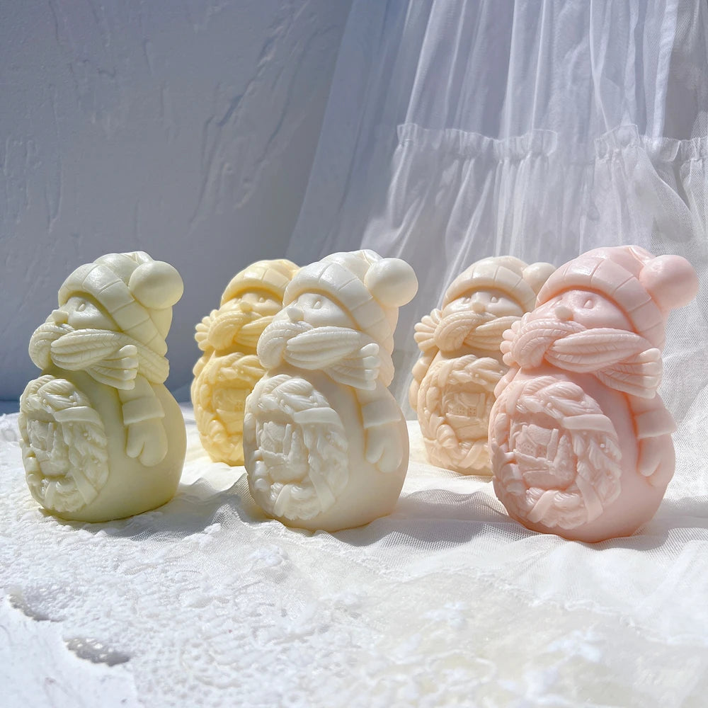Angled snowman castings showing the smaller figures held at the front