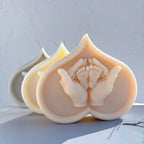 Heart-shaped castings with adult hands cradling small baby feet