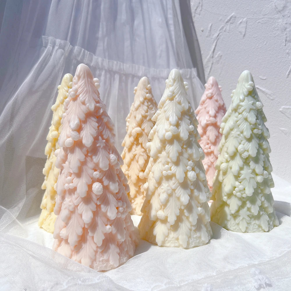 Angled view of snowy-looking branch layers on pastel tree castings