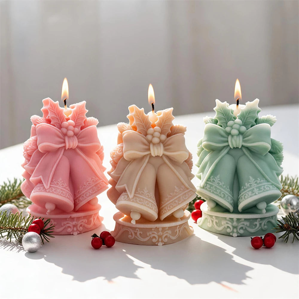 Pink cream and green bell candles showing large ribbon bows