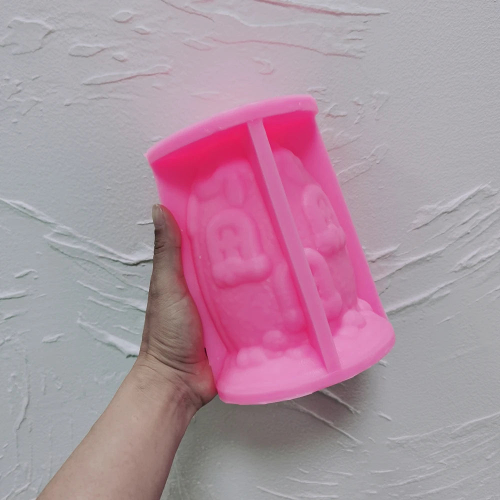 Pink silicone egg cottage mold showing window and door cavities