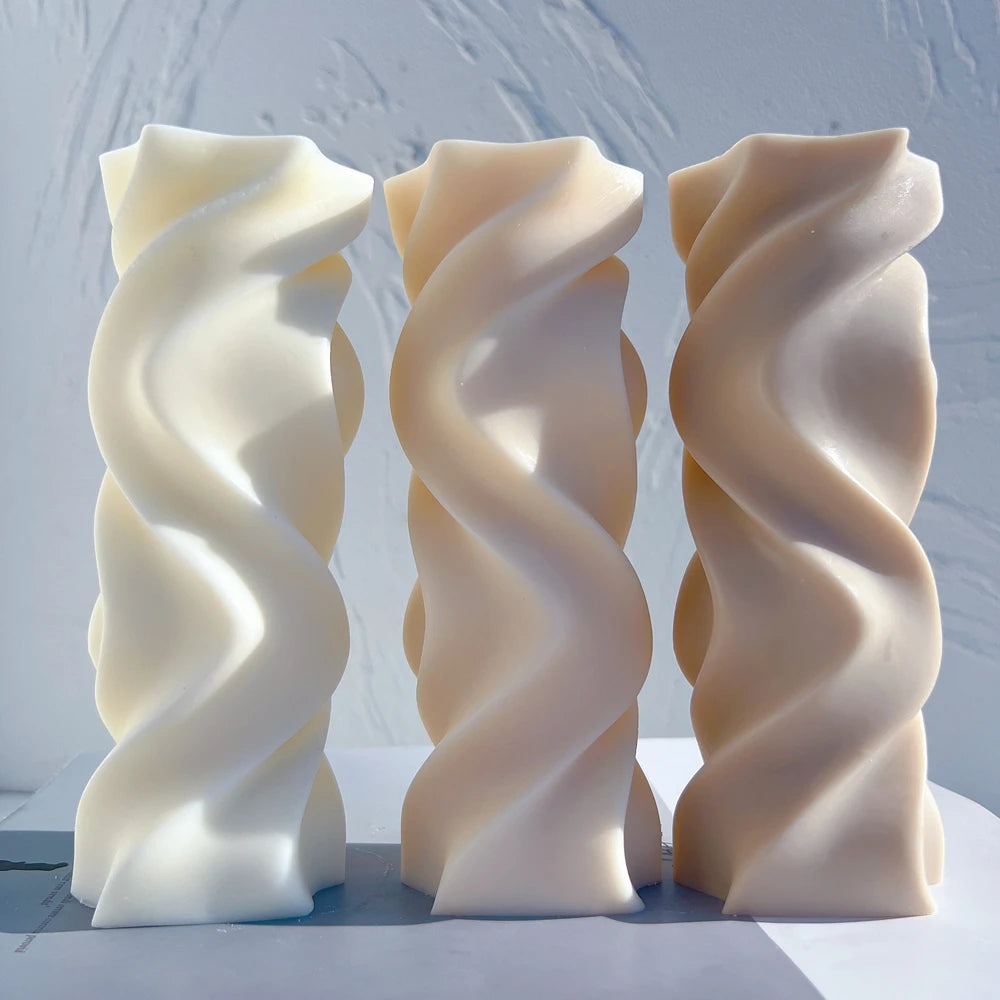 Three smooth wave twist pillar castings with broad flowing ridges