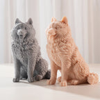 Two pointed-ear dog castings with textured coats and open mouths