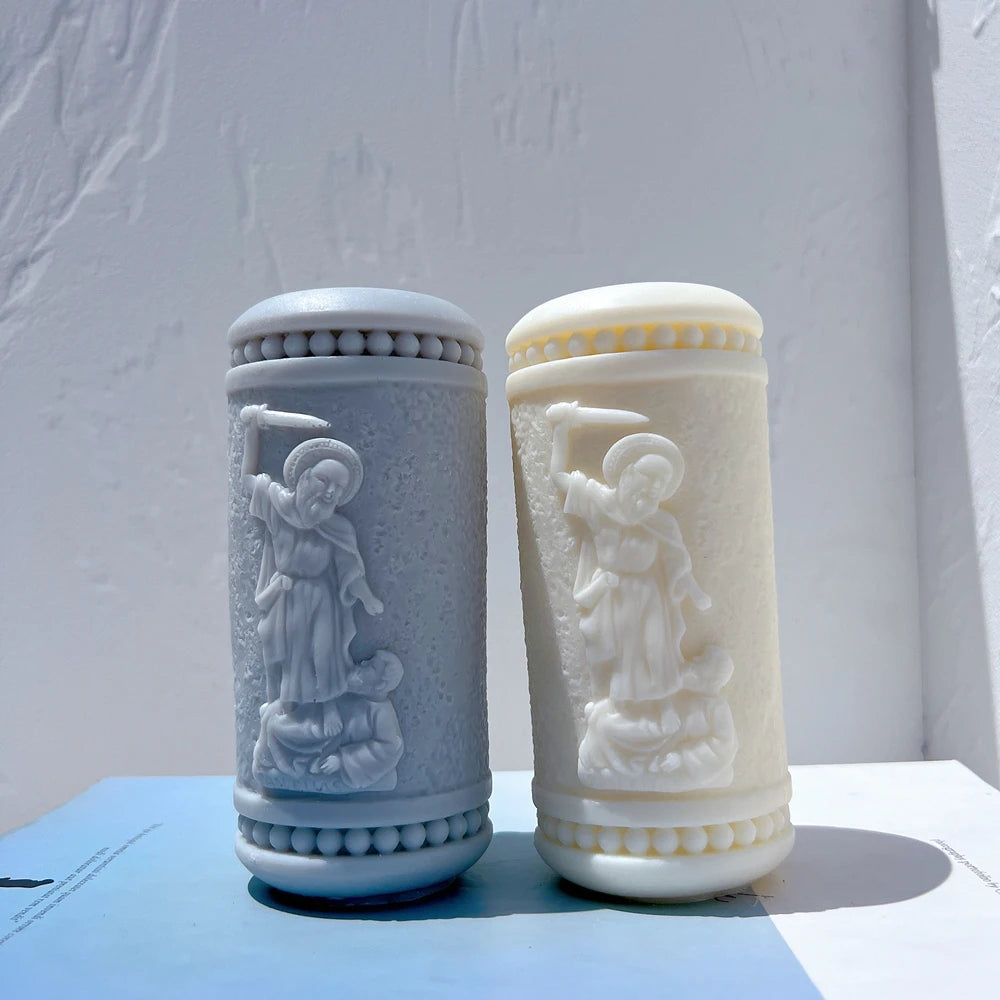 Angled pair of sword-bearing figure relief pillars