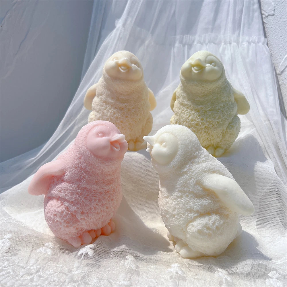 Side views of pastel penguins with rounded bodies