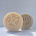 Muhammad and Allah calligraphy reliefs framed by floral crescents