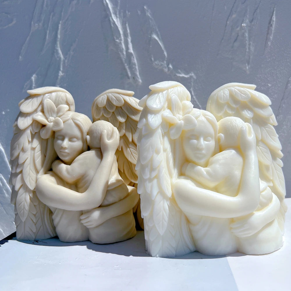 Winged embrace sculptures viewed from the front