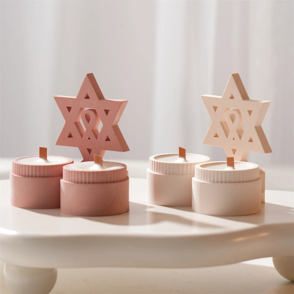 Pink and cream six-pointed star decorative castings above paired cups
