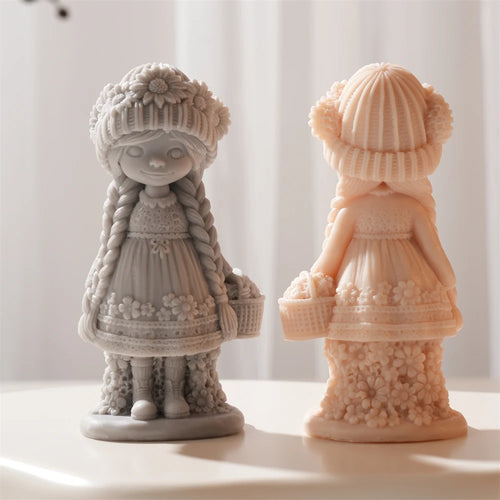 Front of gray flower girl beside the back of a peach casting with basket and dress folds