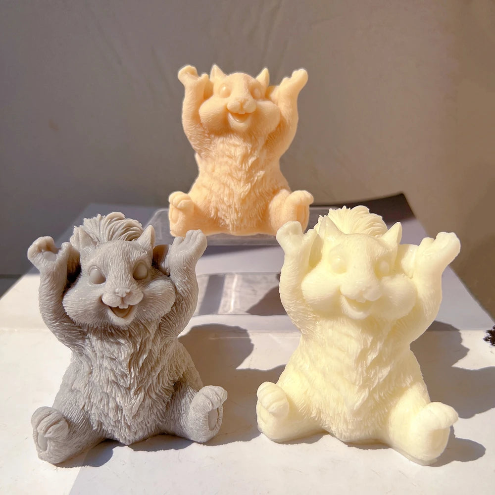 Gray and cream squirrel candle figures on stepped display
