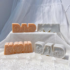 Plain rear of MOM casting beside relief-front DAD and MOM figures