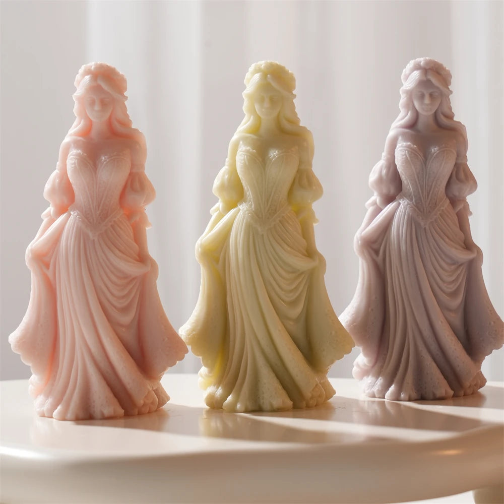 Standing woman figurine candle castings in long flowing gowns