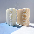 Two rectangular candle blocks with fine diagonal swirl ribs