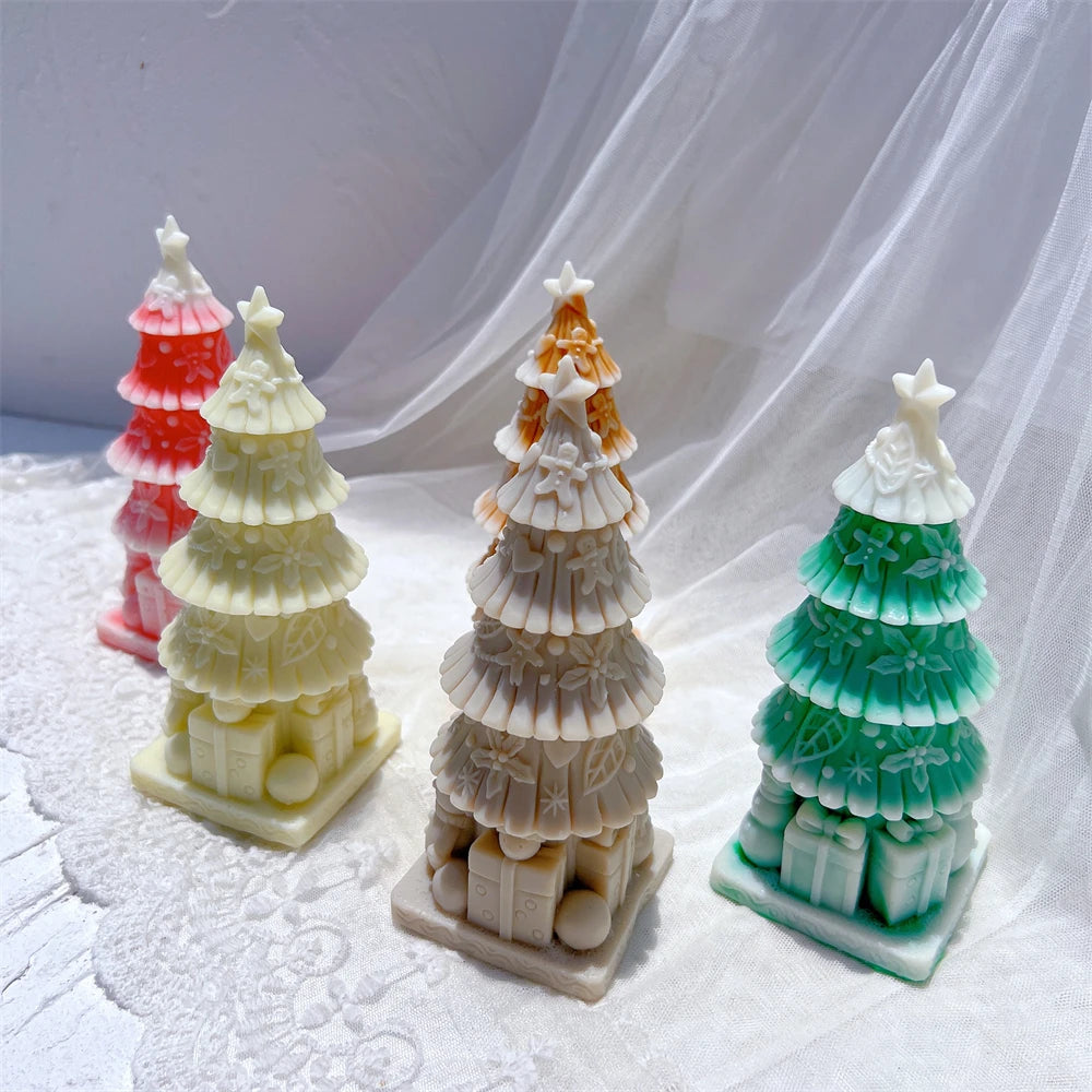 Close-up of decorated tree tiers, star toppers and gift boxes