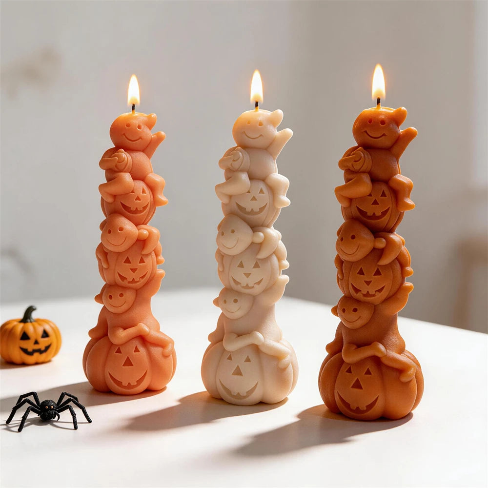 Smiling ghost and jack-o'-lantern candles casting long shadows