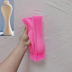 Pink silicone mold for tall slender vase-shaped candle