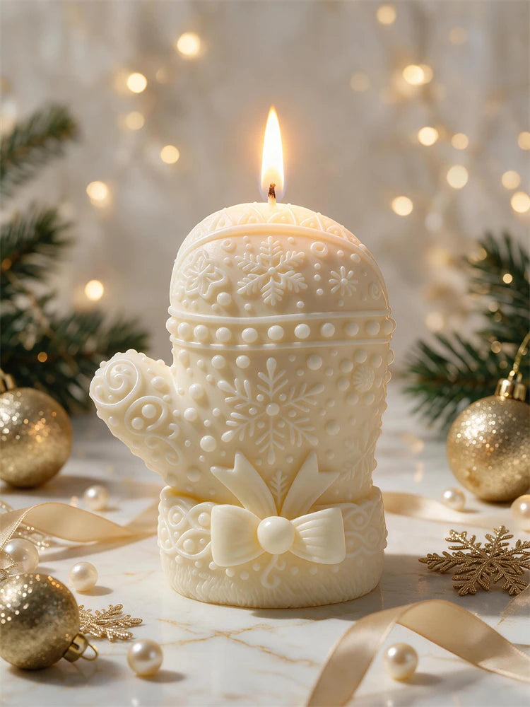 Ivory mitten-like candle with raised knit stitching and winter detail