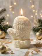 Ivory mitten-like candle with raised knit stitching and winter detail