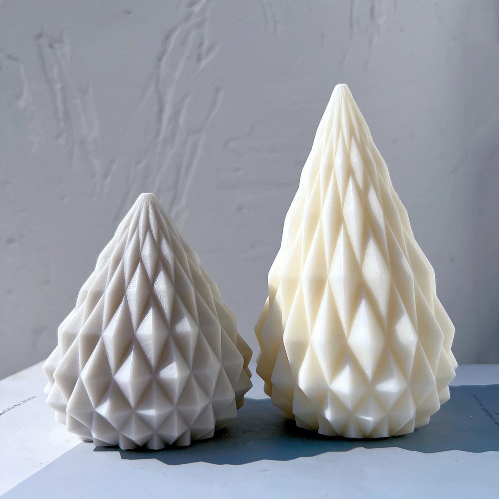Small gray and large cream cone candles side by side