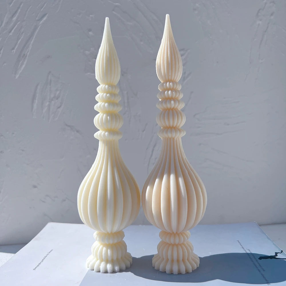Two cream ribbed finial samples showing the stacked rings and pointed tops