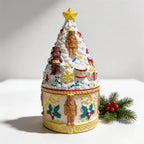 Close view of decorated Christmas tree lid with star and miniature nutcracker reliefs