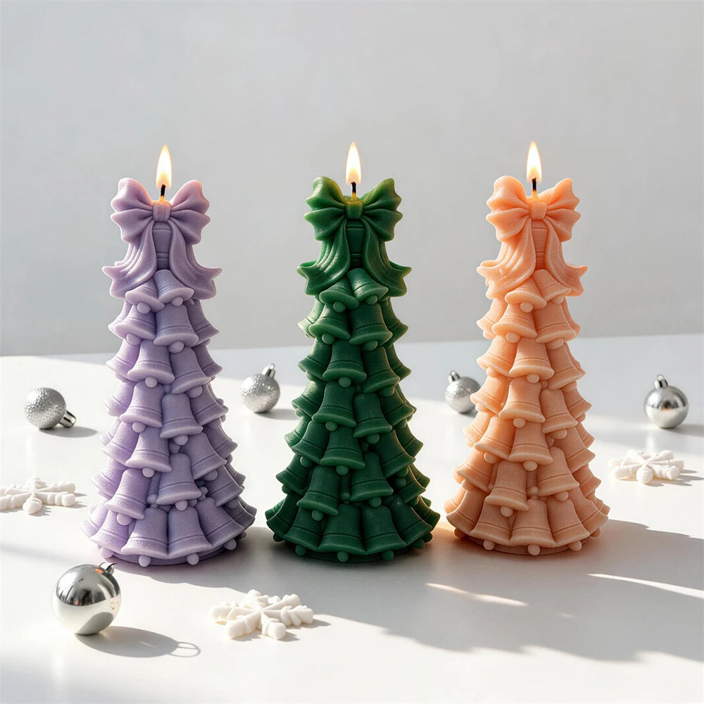 Bell tree candles showing rounded clapper details and ribbon tails