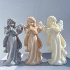 Three standing praying angel castings with joined hands and flowing robes