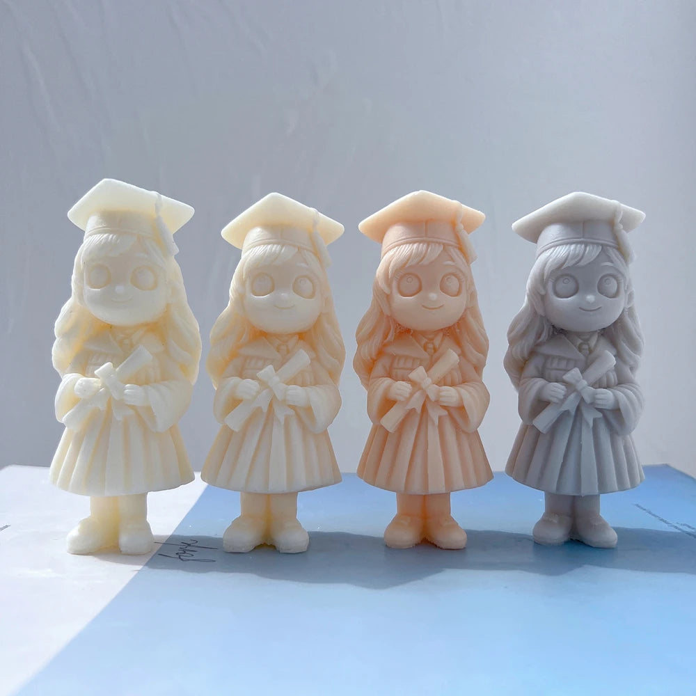 Girl graduate candle castings with long hair and gowns
