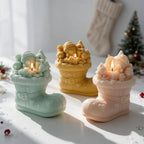 Tree-scene boot candles with rounded festive figures above their cuffs