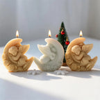 Angel resting on moon candle castings with feather relief