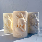 Rabbit cameo pillar candles in cream peach and gray