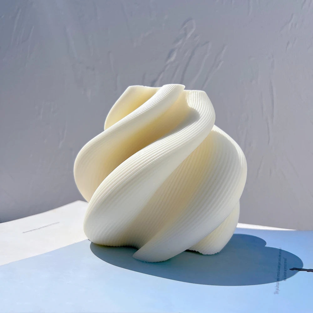 Ivory broad spiral-ribbon casting with fine ribbed surfaces