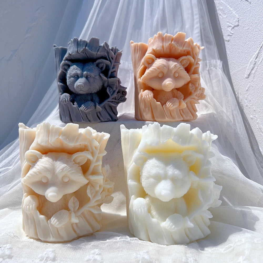 Bear and raccoon faces peeking from tree trunk castings